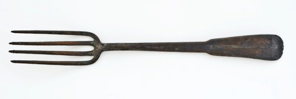 Copper fork with four long teeth and flat handle with spatula-shaped end, fork cutlery soil find copper metal, archeology City