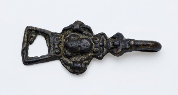 Coat hook or coat closure, cherub head on front, with eye and hook at ends, closure clothing accessory clothing soil find copper