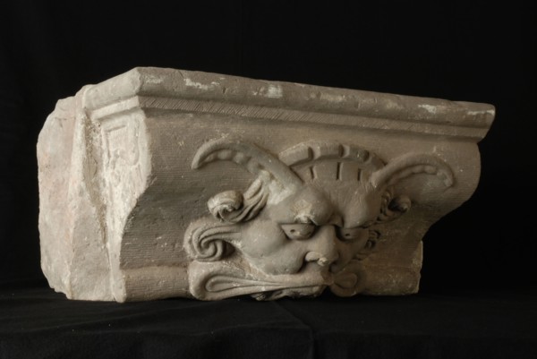Console with devil's head, console building element sandstone stone, sculptured bombardment Rotterdam City Triangle Newport