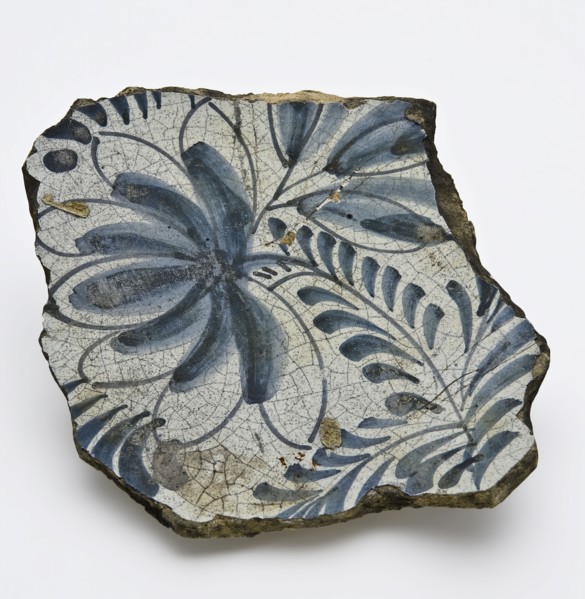 Fragment of majolica dish, mirror with flower in blue, dish crockery holder soil find ceramic pottery glaze tin glaze lead glaze