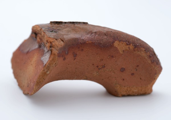 Fragment of red earthenware, partly glazed, fragment crockery holder kitchen utensils earthenware ceramics earthenware glaze