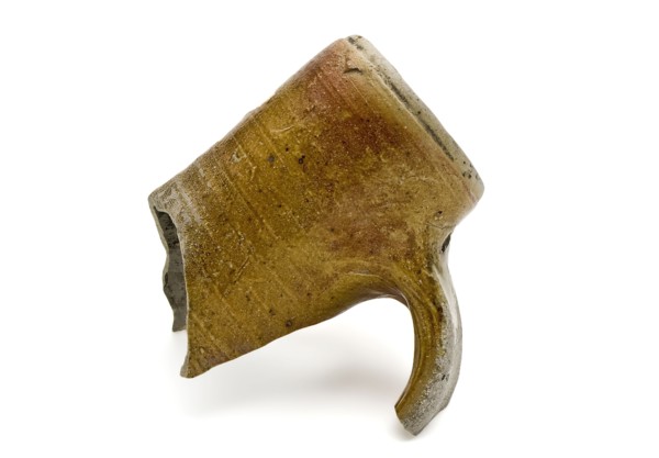 The neck of stoneware jug partly be flamed and partly glazed, drinking jug tableware holder fragment earthenware ceramic