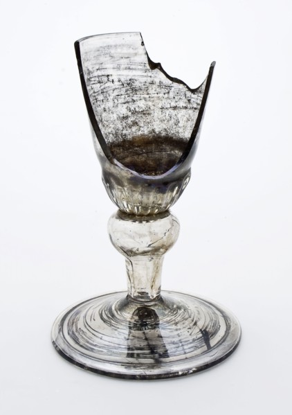 Fragment of the foot, trunk and part of the calyx goblet, drinking glass drinking utensils tableware holder soil find glass, cm