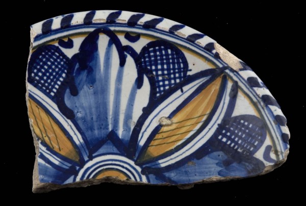 Fragment majolica dish, orange and blue on white, stylized leaf motifs, cable border, plate dish crockery holder earth discovery
