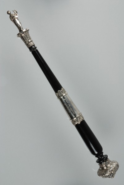Silversmith: Jean George Grebe, Ebony dirigeer pole with silver fittings, topped with molded sculpture of lyre-bearing Muse