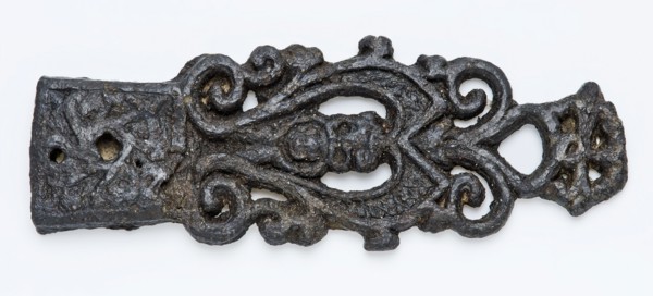Pewter tongue with lion head and openwork curls, fitting belt clothing accessory clothing soil find tin metal, archeology
