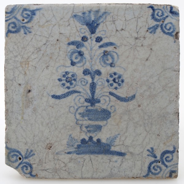 Pottery tile with flower vase and ox head corner decoration in blue on white background, wall tile tile visualization earth