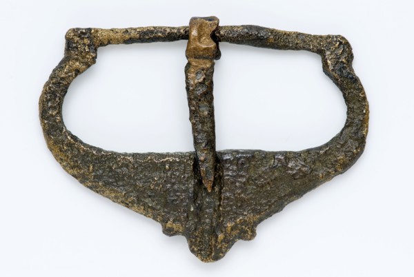 Buckle made of copper or bronze, cast with decorative outside shape, buckle fastener component soil find brass bronze metal