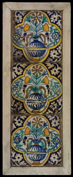 Tile field, three ornament tiles, yellow, orange, green and blue on white, flowerpot in quatrefoil, corner pattern palmet, tiled