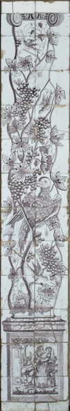Purple tile pilaster, twisted column covered with vine, on which birds, insects, spiders and web, on pedestal of the column