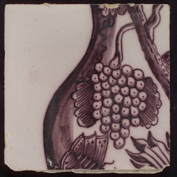 Tile of purple tile pilaster with twisted column on which rank of leaves, grapes, spiders, insects and bird, tile pilaster