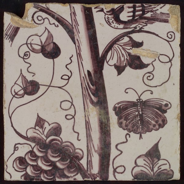Tile of purple pilaster with tree trunk with curled twigs, leaves, bunches of grapes and surrounded by butterflies, bird, tile