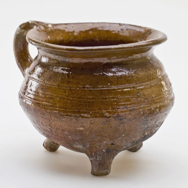 Pottery cooking pot, cooking jug with outstanding top edge, one sausage ear, on three legs, cooking pot crockery holder