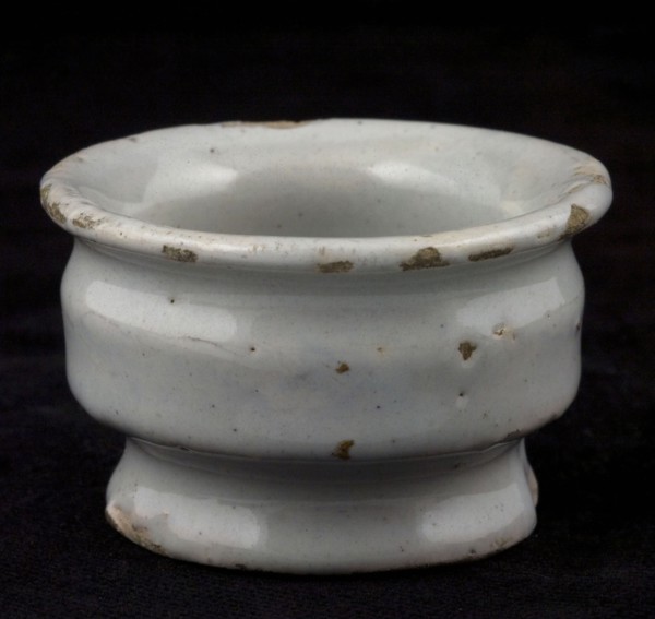 Pottery ointment jar, low model, on base, wide top edge and two constrictions, white glazed, ointment jar pot holder soil found