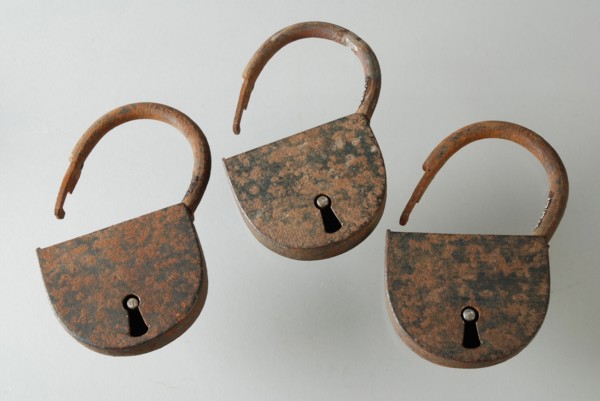 Three similar padlocks with matching keys, which belong to the storage handles of the oak coffin, padlock lock closing device