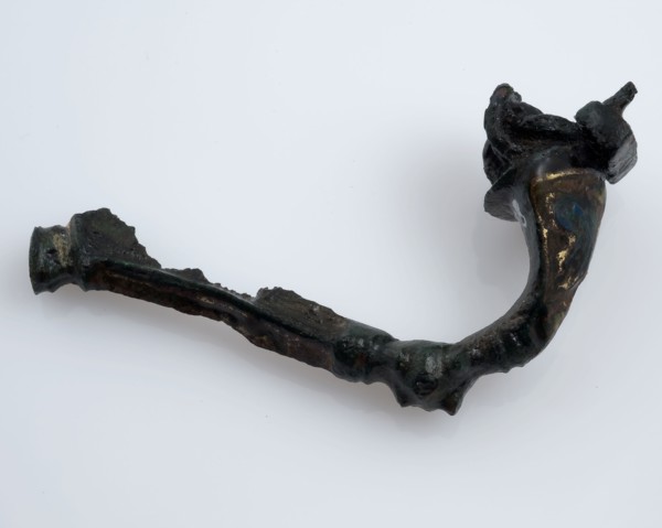 Bronze fibula or mantle pin decorated with enamel, part of the needle remains, fibula fastener soil find bronze metal enamel