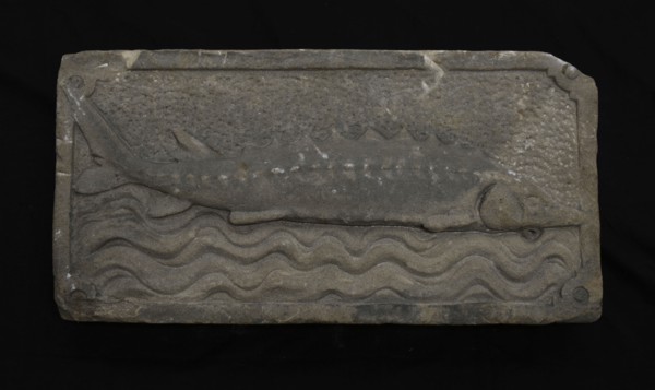 Facade stone with sturgeon on waves, facing brick sculpture sculpture building component sandstone stone, sculpted Rectangular