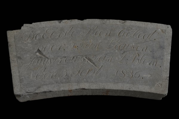 Facade stone with text De Eerste Steen ... Van Leeuwen ... 1836., facing brick first stone building component stone, chopped