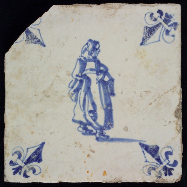 AC, Figure tile, woman with basket on arm, blue decor on white ground, corner filling lily, marked, wall tile tile sculpture