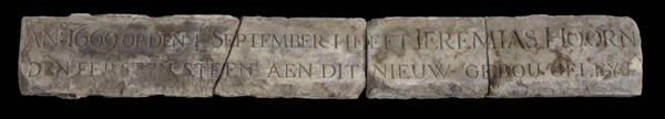 Elongated facing brick with text: 1669 ... First stone ... Jeremias Hoorn, facing bricks building limestone stone, Rectangular