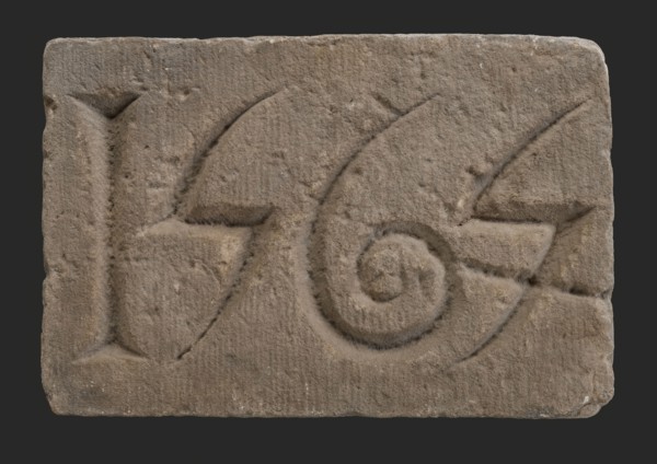 Facade stone with date 1565, Dominican monastery, facing brick foundation stone building component sandstone stone, minced