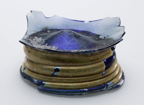 Fragment of part foot, bottom and part wall of bowl in blue glass, bowl crockery holder soil find glass, hand-blown Fragment