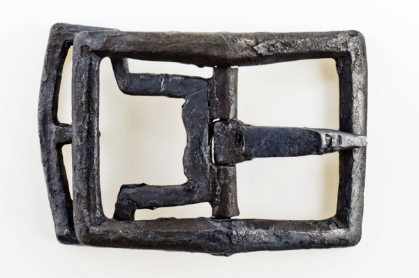 Shoe buckle, rectangular bracket with middle post with angel and bounce, buckle fastener component soil find tin copper? metal