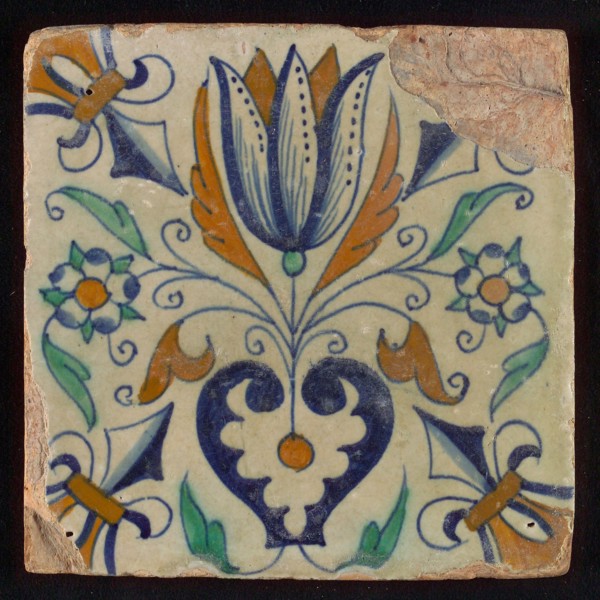 Tile, blue draft, brown, orange and green on white, centrally tulip and heart, corner motif lily, wall tile tile sculpture
