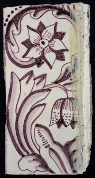Rectangular edge tile in purple with sling decor of speckled tulip, flower with ten triangular petals
