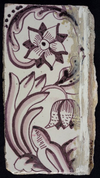 Rectangular edge tile in purple with sling-decoration of speckled tulip, flower with ten triangular petals