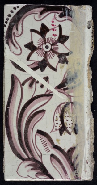 Rectangular edge tile in purple with sling decor of speckled tulip, flower with ten triangular petals