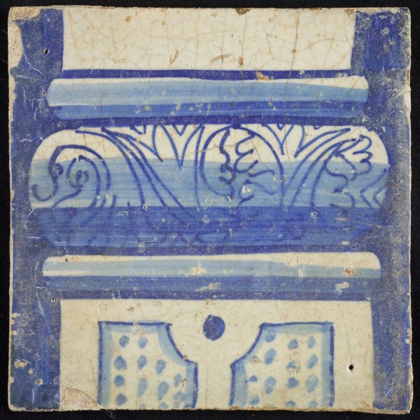 Tile of chimney pilaster, blue on white, part of pillar with basement with floral decoration, division with dots, chimney