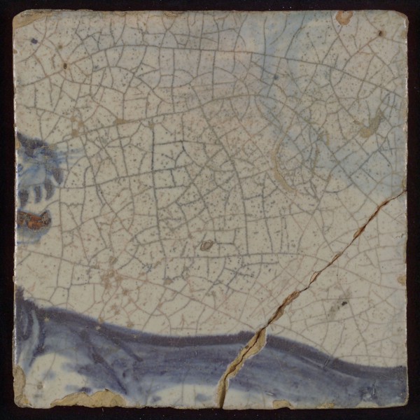 Multi-colored tile (blue, brown) with part of lion's head, tile picture footage fragment ceramics pottery glaze, d 1.2