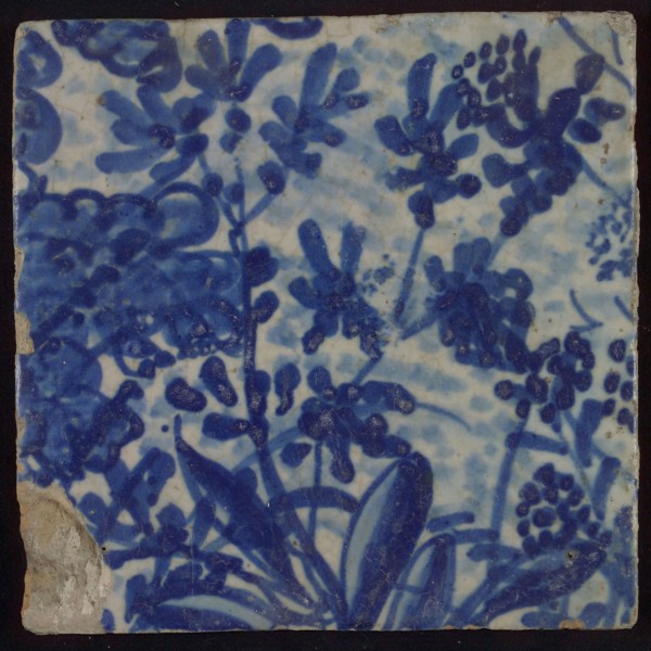 Tile with blue flowers and leaves, tile picture footage fragment ceramics pottery glaze, d 1.2