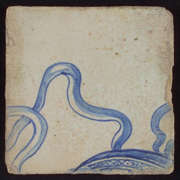 Tile with blue ribbons on part of hat, tile pilaster footage fragment ceramics pottery glaze, d 1.3