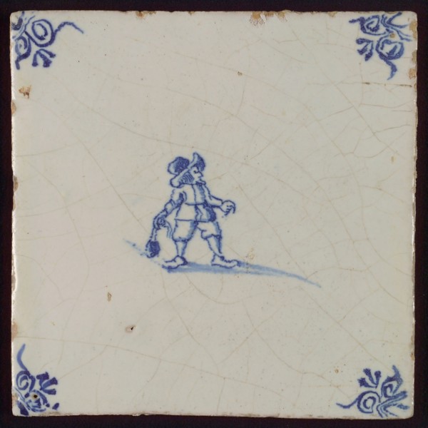 Scene tile, child's play, child with boulder, corner pattern ox's head, wall tile tile sculpture ceramic earthenware glaze