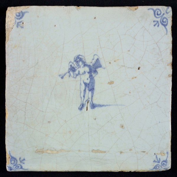 Light blue tile with blue putto with wind instrument; corner pattern ox head, wall tile tile sculpture ceramic earthenware glaze