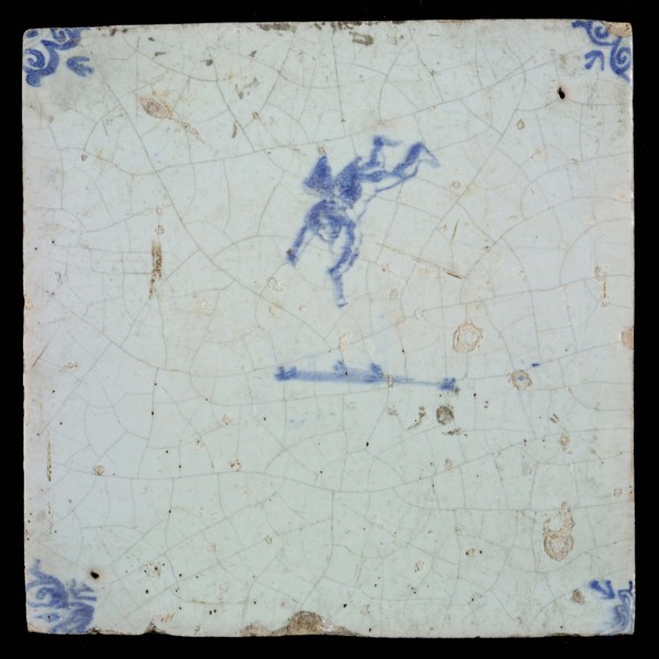 White tile with blue flying putto with wind instrument; corner pattern ox head, wall tile tile sculpture ceramic earthenware
