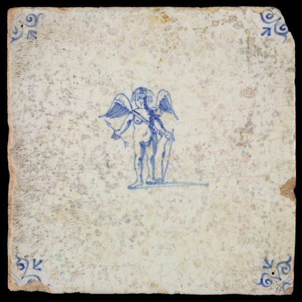 White tile with blue cupid with bow and arrow; corner pattern ox head, wall tile tile sculpture ceramic earthenware glaze, baked