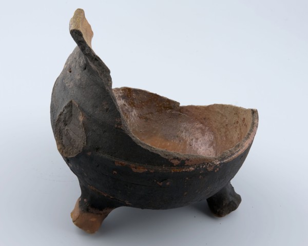 Fragment of the cooking jug on three legs, grape cooking pot crockery holder kitchen utensils earthenware ceramics earthenware