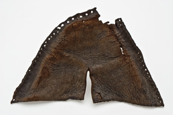 Cover of leather children's shoe, with notch in the middle of the leaf and along the edges of the sewing thread, shoe footwear