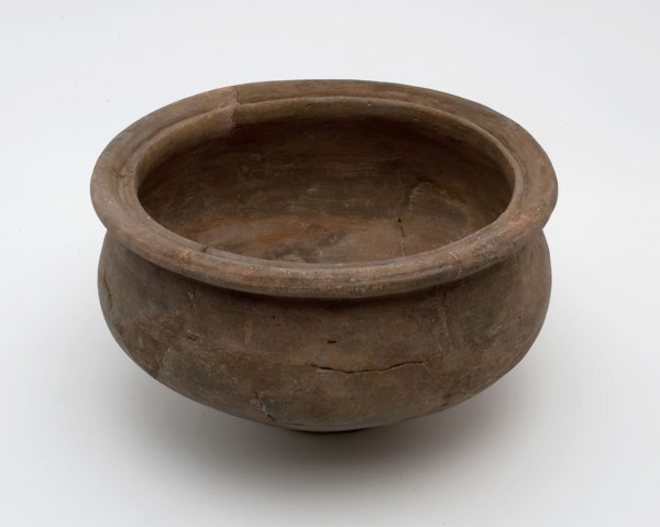 Small brown pot on narrow stand, baluster shape with grooved top edge, Roman pottery, pot holder soil find ceramic pottery, hand