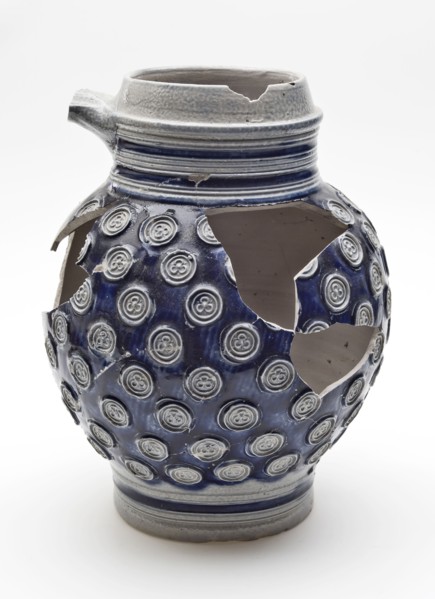 Stoneware jug decorated with small rosettes on blue background, jug crockery holder soil find ceramic stoneware glaze salt glaze