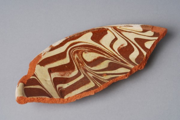 Fragment of earthenware plate with decor in sludge flow technique, plate crockery holder fragment earthenware ceramics