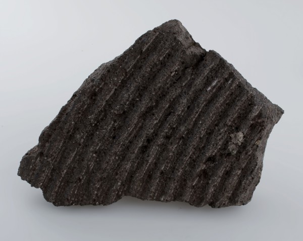 Fragment grinding stone, with circular grinding rings, millstone found in natural stone stone, split sawn chiseled Fragment