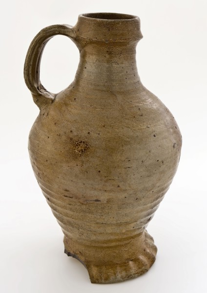 Light brown-gray stoneware jug with pinched foot, ledge around neck edge, jug crockery holder soil find ceramic stoneware clay