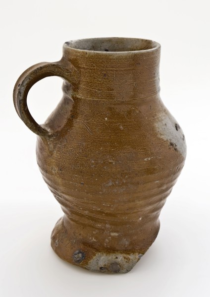 Light brown stoneware drinkan, with pinched foot, pot jug crockery holder soil find ceramic stoneware clay engobe glaze salt