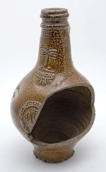 Brown speckled Bartmann jug, also called Bellarmine jug, under beard mask part of medallion, beardmug tableware holder soil find