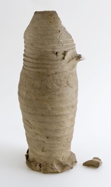 Fragment of stoneware pot on pinched foot with wide, cylindrical neck, jug crockery holder soil find ceramic stoneware, surface