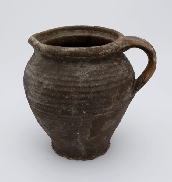 Brown jug with ear and shaving, jug crockery holder soil find ceramic stoneware clay engobe, hand-turned baked Stoneware jug